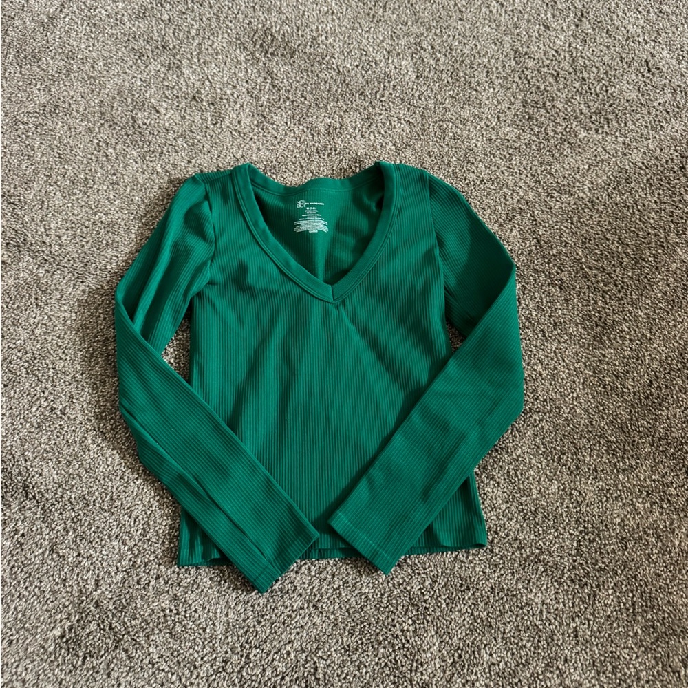 Green athletic long sleeve.